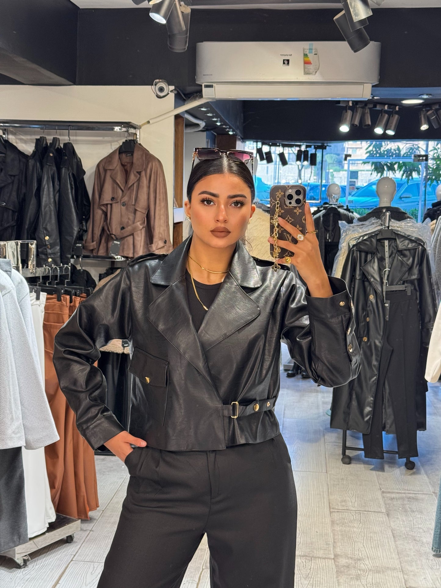 Cropped one sided gold belted leather jacket